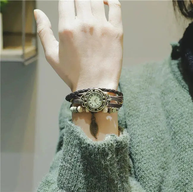 Shourui quartz wristwatch for women with vintage round dial and braided leather strap on wrist
