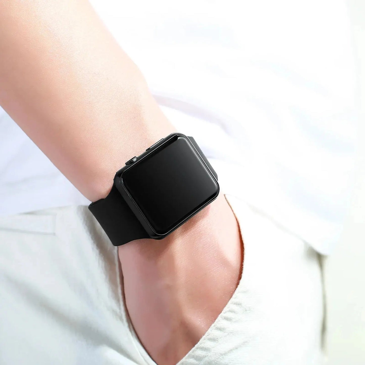 Alcom Distribution simple fashion digital watch black square face with silicone strap on wrist