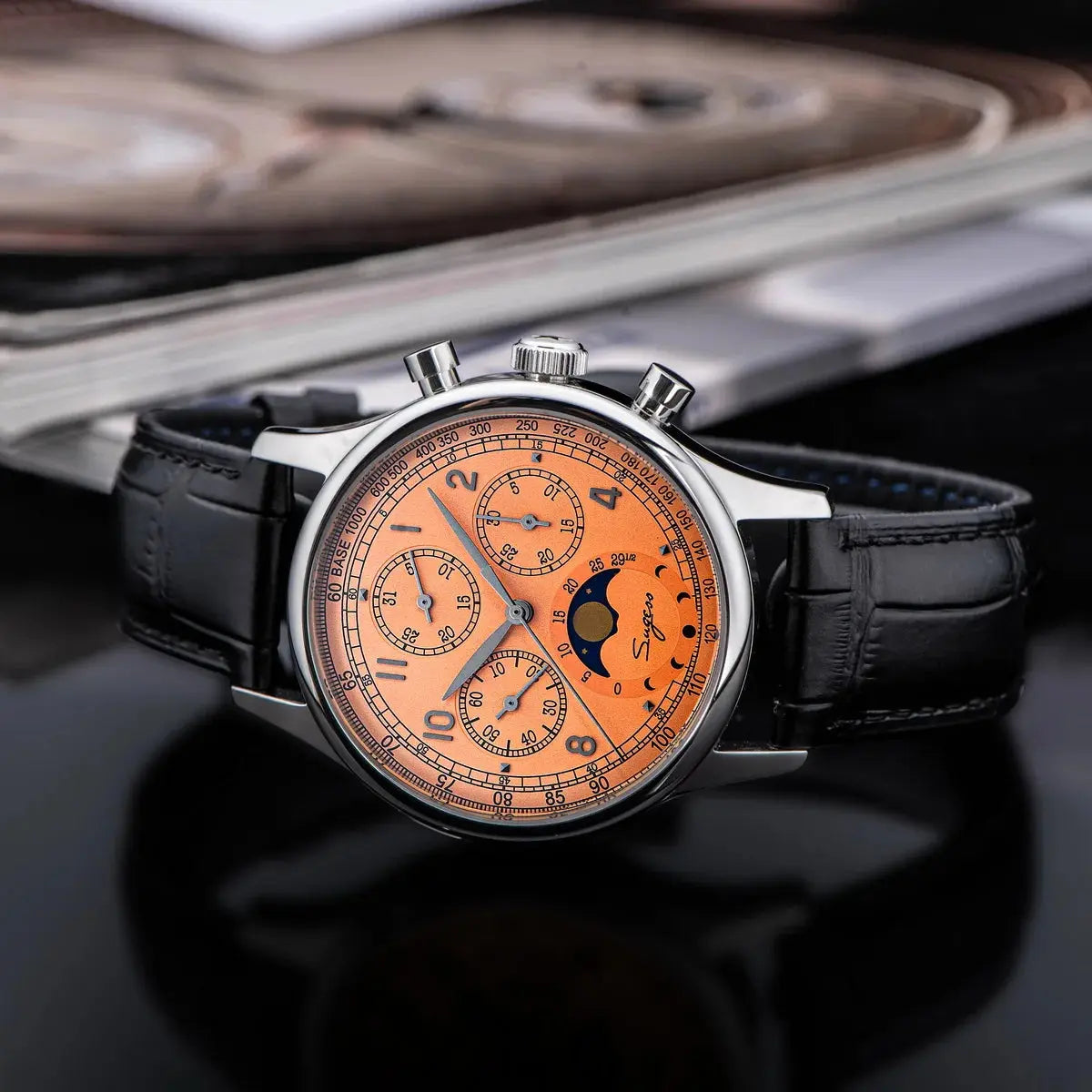 Sugess mechanical chronograph watch with orange dial and black leather strap by Alcom Distribution