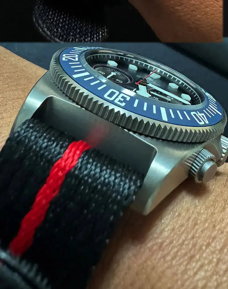 Alcom Distribution titanium diving watch featuring a bold blue bezel and durable strap for underwater adventures
