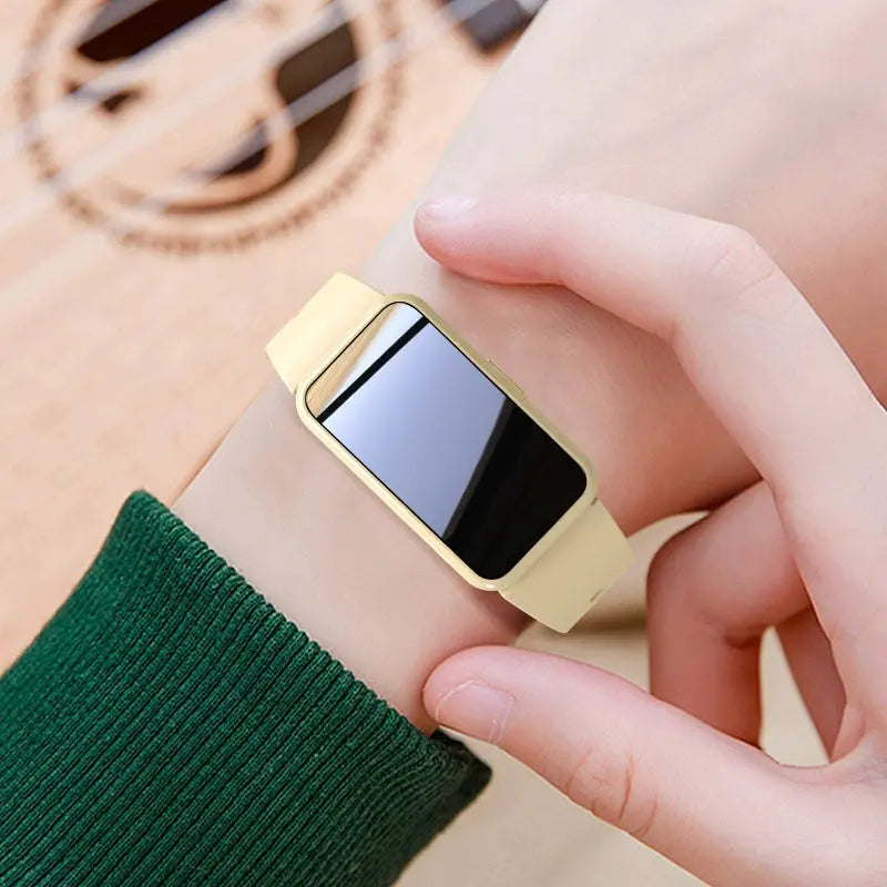 Tech-savvy fitness wearable by Alcom Distribution with sleek rectangular touchscreen and beige strap