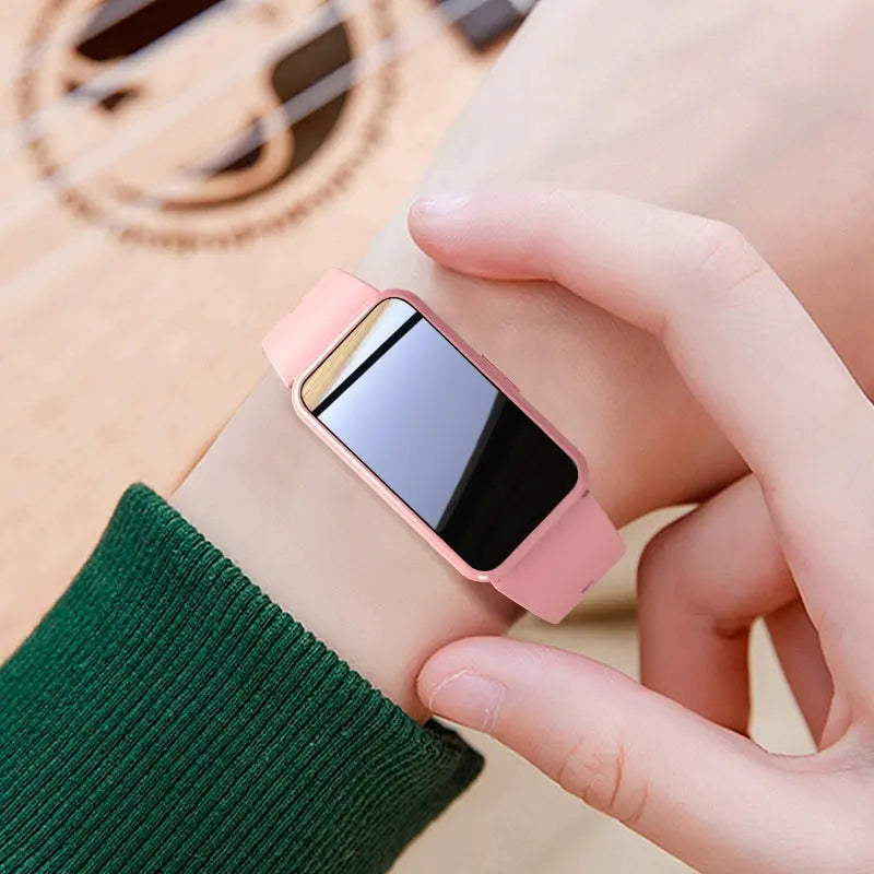 Alcom Distribution pink tech-savvy fitness wearable watch with sleek rectangular screen on wrist