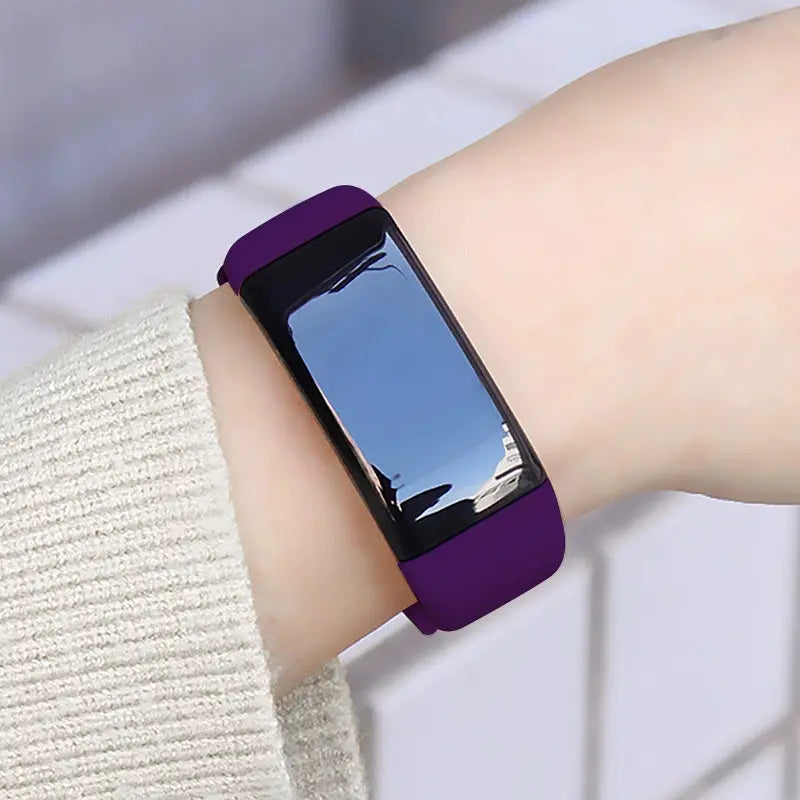 Alcom Distribution purple tech-savvy fitness wearable on wrist with sleek touchscreen display