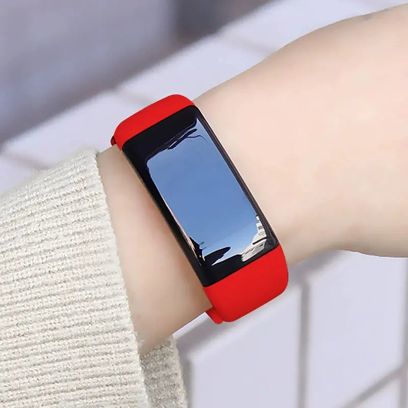 Alcom Distribution tech-savvy fitness wearable with red band and black touchscreen display