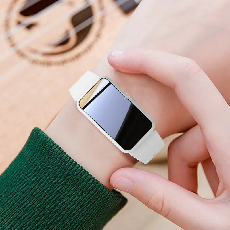 Alcom Distribution tech-savvy fitness wearable with white band and sleek rectangular display on wrist