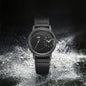 Minimalist men's leather watch by Alcom Distribution with black dial and leather strap