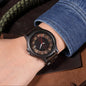 Alcom Distribution unisex wooden watch with dark wood case and transparent dial on wrist