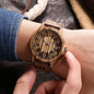 Alcom Distribution unisex wooden watch with natural wood grain design on wrist