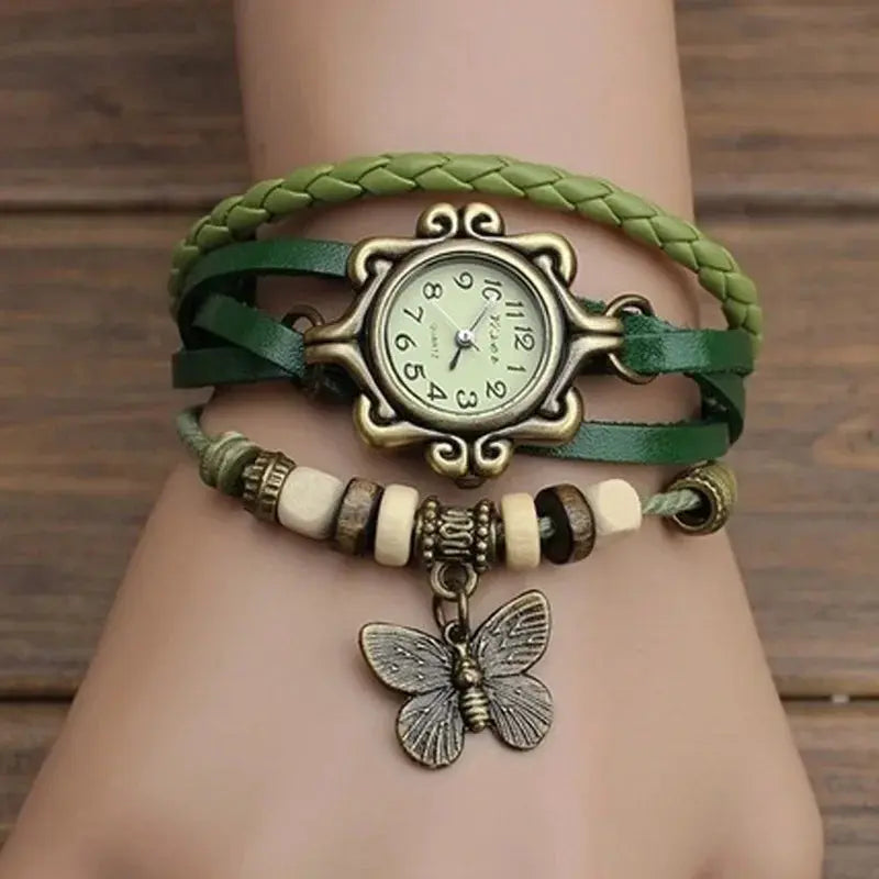 Vintage butterfly bracelet watch with green braided and leather straps featuring butterfly charm by Alcom Distribution