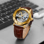 Alcom Distribution vintage golden skeleton watch with brown leather strap and visible mechanical movement