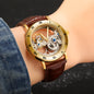 Vintage golden skeleton watch by Alcom Distribution with brown leather strap and Roman numeral dial