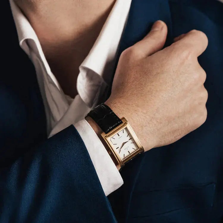 Luxury men's watches featuring a sleek black stainless steel chronograph timepiece with intricate dial details