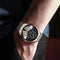 Alcom Distribution luxury double tourbillon watches with black dial and silver gold metal strap on wrist