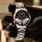 Luxury double tourbillon watches with rose gold and silver stainless steel band held by gloved hand