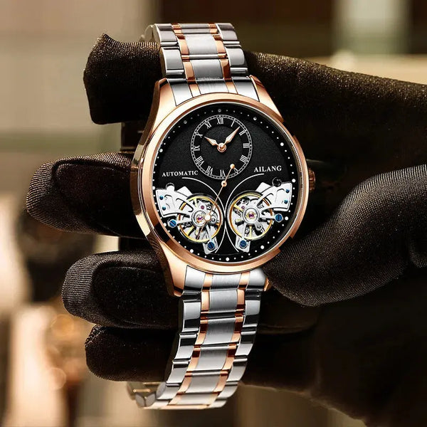 Luxury double tourbillon watches with rose gold and silver stainless steel band held by gloved hand