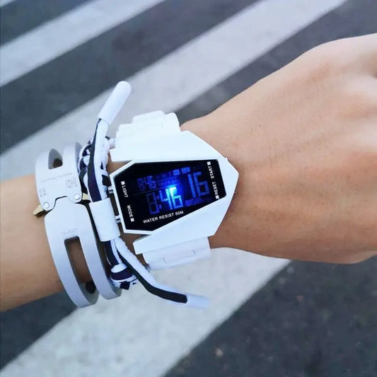 Alcom Distribution white aircraft-inspired digital watch with blue display worn on wrist