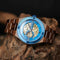 Luxury wooden mechanical watch with blue bezel and visible gears by Alcom Distribution