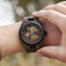 Alcom Distribution luxury wooden mechanical watch worn on wrist showcasing intricate gears and dark wood finish