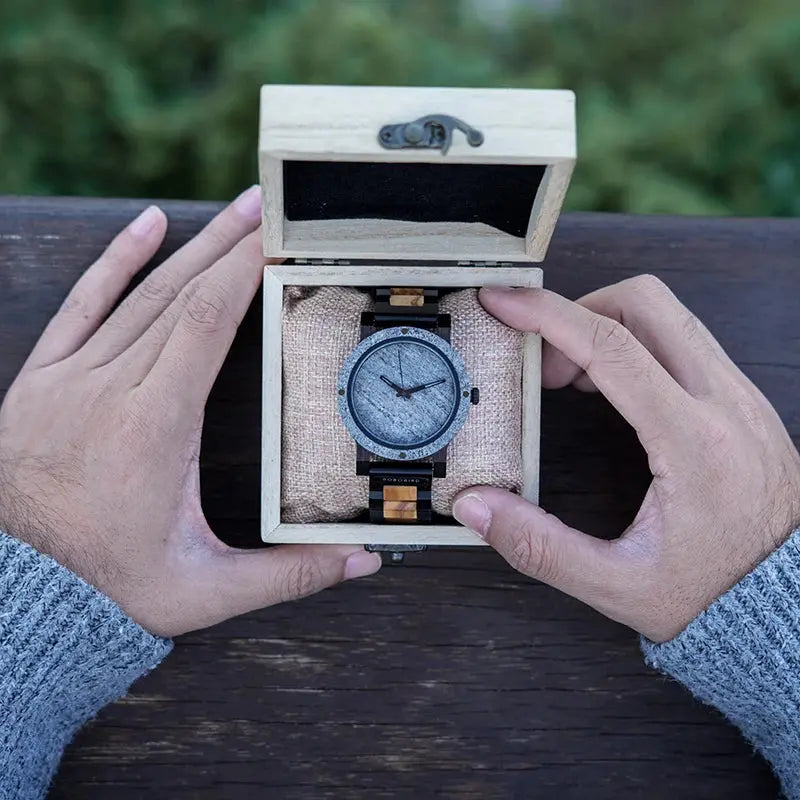 Stylish wood and stone watch by Alcom Distribution in wooden gift box held by hands