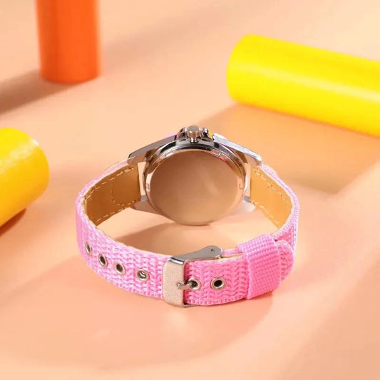 Alcom Distribution kids quartz watch colorful with pink fabric strap and silver buckle on peach background