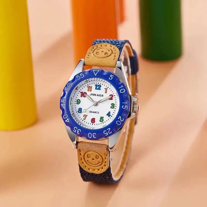 Alcom Distribution kids quartz watch colorful with blue bezel and smiley face strap detail