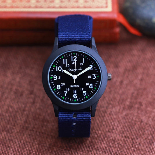 Black kids waterproof watch with blue fabric strap and clear white numeric dial by Alcom Distribution