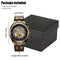 Classic style automatic watch with gold case and brown leather strap displayed with black watch box