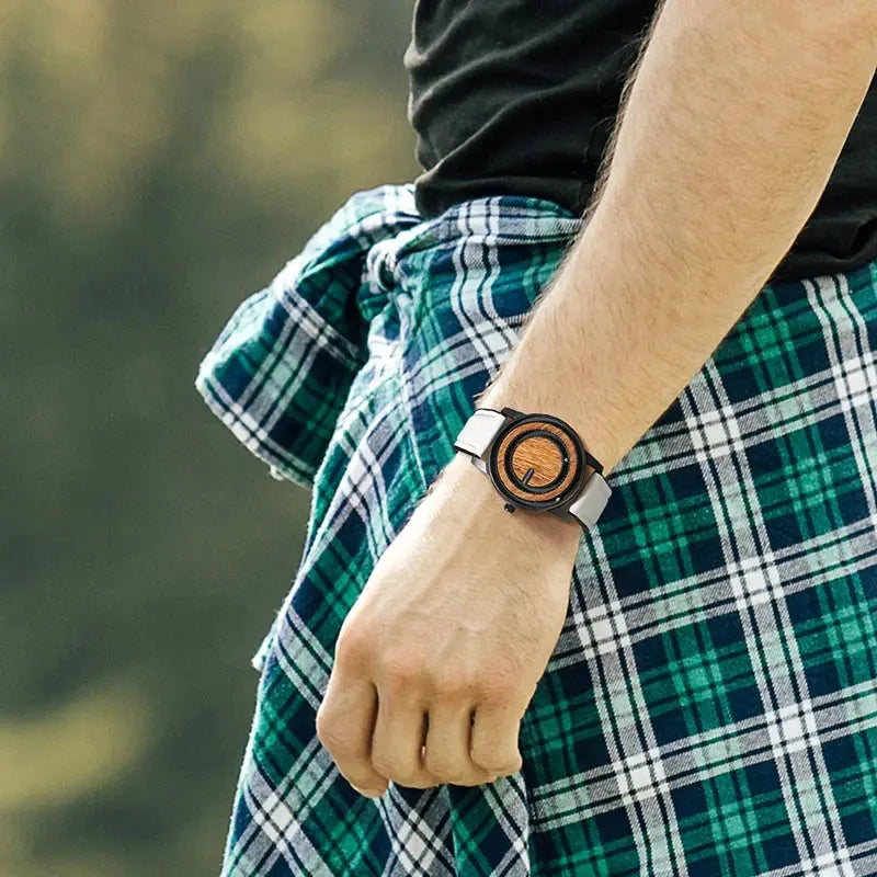 Stylish Magnetic Bead Watch on wrist with black and wooden dial and white strap by Alcom Distribution