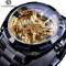 Forsining skeleton watch with black metal band and gold mechanical inner workings visible