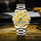 Stylish men's wristwatch with gold and silver metal band and detailed yellow dial by Alcom Distribution