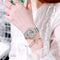 Alcom Distribution Hollow Skeleton Quartz Watch with silver mesh band on wrist showing mechanical design
