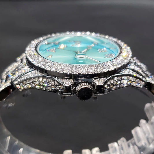 Alcom Distribution diamond-studded watch with turquoise face and sparkling stones on bezel and bracelet