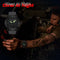 NORTH EDGE solar watch with glowing hands worn by a man operating equipment at night