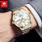 OLEVS diamond business watch in silver and gold tones on wrist with white dial and diamond hour markers