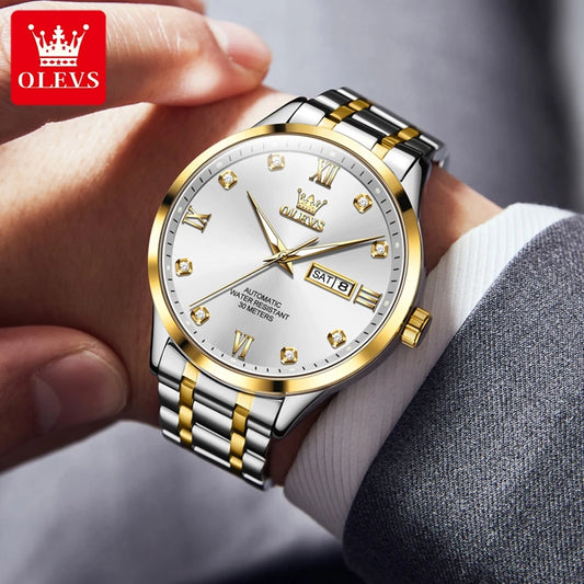 OLEVS diamond business watch with gold and silver band on wrist showing date and time
