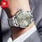 OLEVS diamond business watch with silver metal band and diamond hour markers on wrist