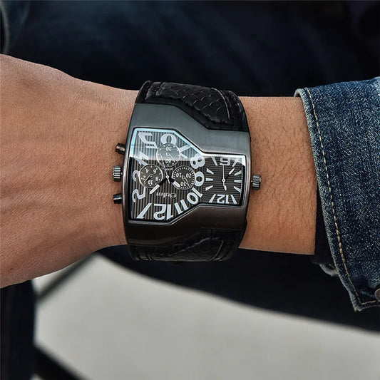 Alcom Distribution black rectangular men's dual time wristwatch with textured leather strap and bold numerals on wrist