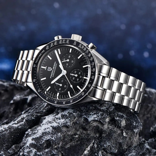 Pagani Design chronograph watch with black dial and stainless steel bracelet on rocky surface