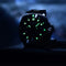 Pagani Design diver watch with luminous markers and black stainless steel case in dark setting