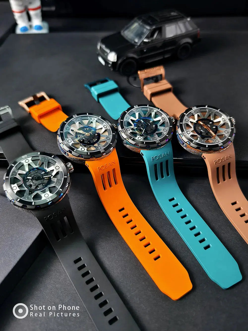 Timascus automatic watch collection with colorful silicone straps including black, orange, teal, and tan bands