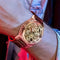 Premium men's watch with mechanical movement by Alcom Distribution featuring intricate gears and leather strap