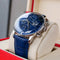 Reef Tiger luxury men's watch with blue dial and leather strap displayed on cushion