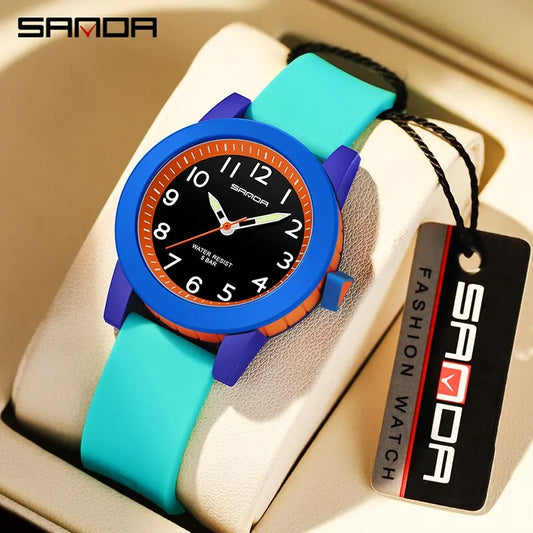 Children's shock resistant watch by Alcom Distribution with blue and turquoise strap and black dial