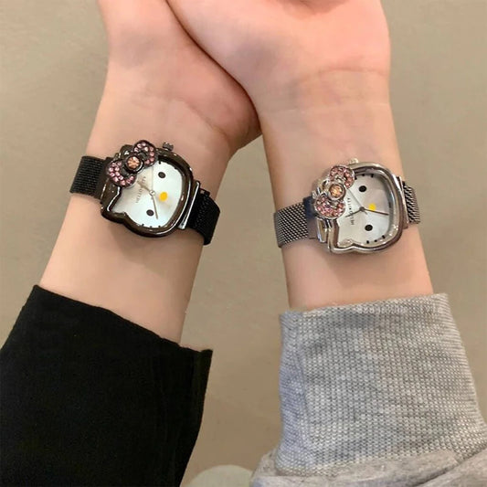 Alcom Distribution hello kitty diamond watch on two wrists showing black and silver mesh bands jeweled bow and Hello Kitty face