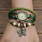 Vintage butterfly bracelet watch with green braided and leather straps featuring butterfly charm by Alcom Distribution