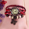 Vintage butterfly bracelet watch with red braided leather strap and decorative beads by Alcom Distribution