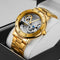 Vintage golden skeleton watch by Alcom Distribution with intricate mechanical design and gold metal band