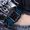 Alcom Distribution digital 50M waterproof watch with black and blue design on wrist
