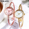 Alcom Distribution retro gold bangle watch with round dial and elegant twisted metal band