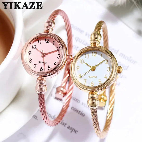 Alcom Distribution retro gold bangle watch with round dial and elegant twisted metal band